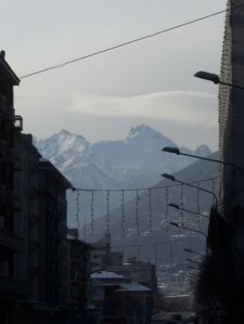 Mount Blanc looms in the distance of the city.